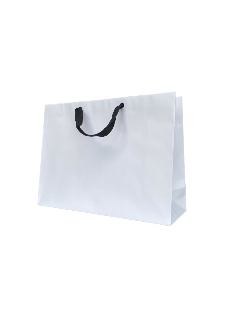 White paper bag with black ribbon handles