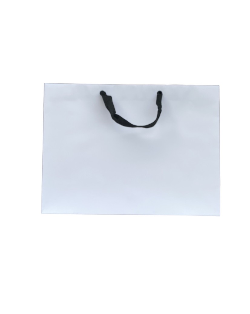 White paper bag with black ribbon handles